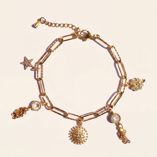 Bracelet Verika Bijoux Iris doré à breloques étoile, œil et trèfle sertis de cristaux