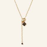 Sautoir Fauve porté, pendentif œil de tigre et breloque martelée - Verika Bijoux